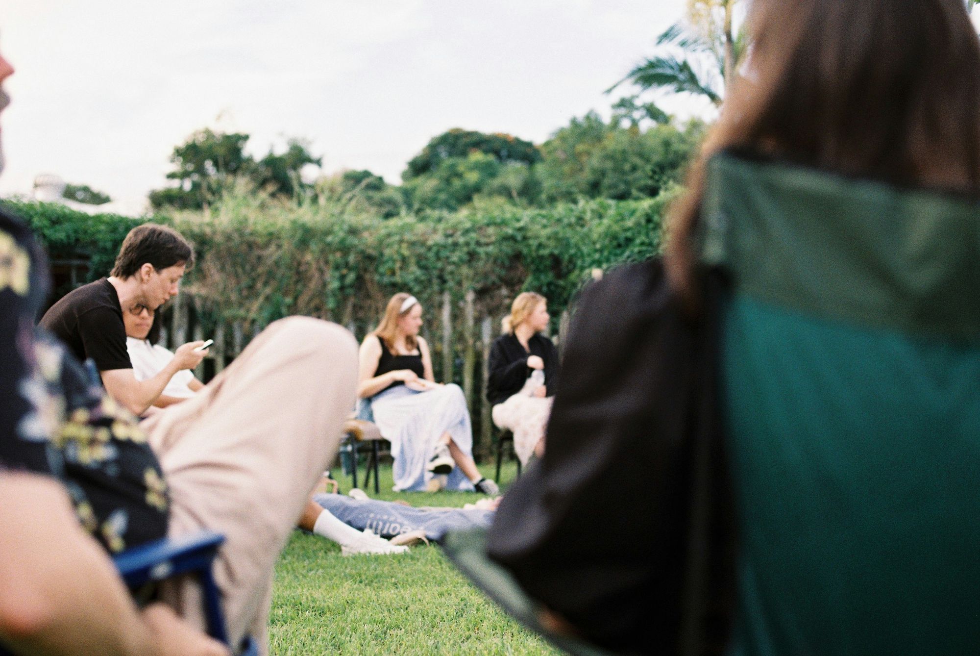 People gathered outdoors on a sunny afternoon